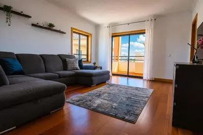 a kitchen with a table with a bowl of fruit on it at Corcovada, Sunny and Bright T1 with Large Terrace, Albufeira in Albufeira
