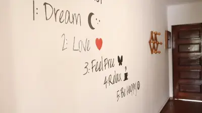 a wall with writing on it on a wall at Visconde By Albufeira Rental in Albufeira