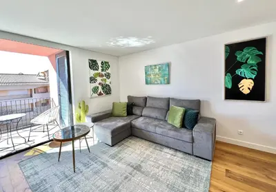 a living room with a couch and a table at One - Luxurious apartment by HD PROPERTIES in Vilamoura