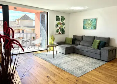 a living room with a couch and a table at One - Luxurious apartment by HD PROPERTIES in Vilamoura