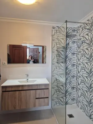 a bathroom with a sink and a mirror at casa Vela in Albufeira