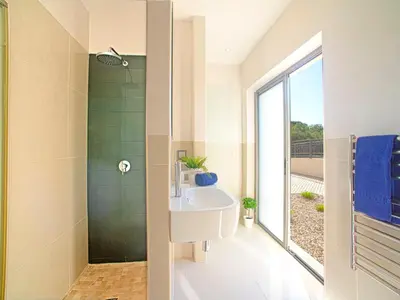 a bathroom with two sinks and a mirror at Apartment Pine Hills Esmeralda by Interhome in Vilamoura