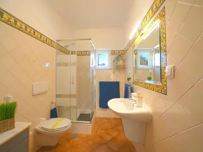 a bathroom with a toilet and a sink and a mirror at Villa Mariana by Interhome in Galé