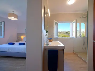 a bathroom with a bed and a sink and a shower at Villa Mariana by Interhome in Galé
