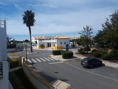 a street with a car parked in a parking lot at 1-Bed - Sleeps 4 - Free Parking & Balcony in Albufeira