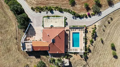 an aerial view of a house with a swimming pool at Quinta Coelho in Guia