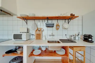 a kitchen with a sink and a counter top at Quinta Coelho in Guia