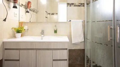a bathroom with a sink and a shower at Casa da Praia - São Rafael - BY BEDZY in Albufeira