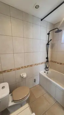 a bathroom with a toilet and a bath tub at Oura Villa V2 Jacarandá in Albufeira