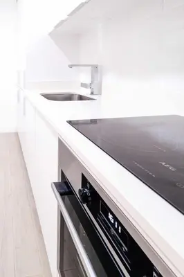 a white kitchen with a sink and a dishwasher at Oura Villa V2 Flores in Albufeira