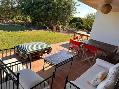 a large grassy field with a swimming pool at Casa do Cabeçudo in Faro
