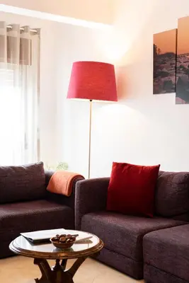 a living room with a couch and a table at OLIVE - Quarteira in Quarteira