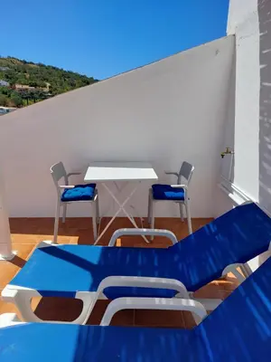 a table and chairs in a room with a blue table at 