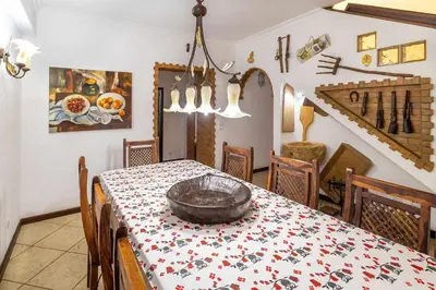 a dining room with a table with a bowl on it at Villa V4 Máximo in Albufeira