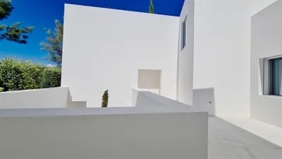a white facade of a house with a window at Villa BEA - Clever Details, Luxury, Golf views, Sleeps 10 in Vilamoura