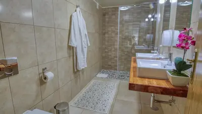 a bathroom with a sink and a shower at 8-Bed Villa in Vilamoura-Sleeps-Playground-Pool in Vilamoura