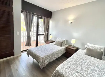 a hotel room with two beds and a window at Marina Jardim - Vilamoura Marina by HD Properties in Vilamoura