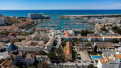 an aerial view of a city with a marina at Marina Village in Vilamoura