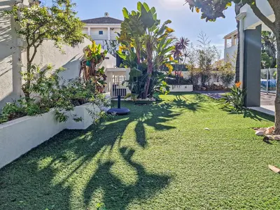 a yard with green grass and trees and a building at Villa Stefy by Bedzy in Galé