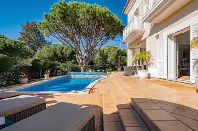a house with a swimming pool in a yard at Villa Anna - Vale de Lobo in Faro