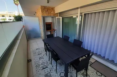 a black table and chairs on a balcony at Panoramic View Apartment in Albufeira