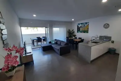 a living room with a couch and a table at Panoramic View Apartment in Albufeira