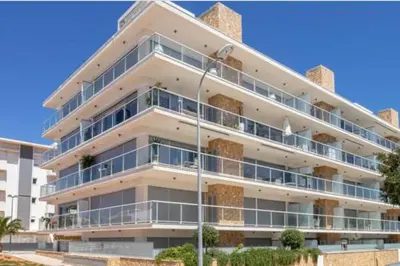 an apartment building with balconies and a street light at Panoramic View Apartment in Albufeira