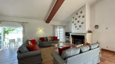 a living room with two couches and a fireplace at Espraguina by Check-in Portugal in Loulé
