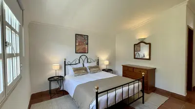 a bedroom with a bed and two lamps and a window at Espraguina by Check-in Portugal in Loulé
