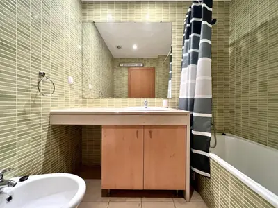 a bathroom with a sink and a mirror at Albufeira Modern 4 With Pool by Homing in Albufeira