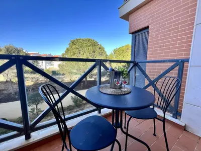a table and chairs on a balcony with a view at Albufeira Modern 4 With Pool by Homing in Albufeira