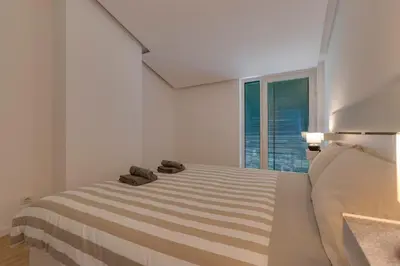 a bedroom with a bed with two slippers on it at VILASOL - 