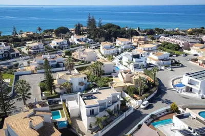 an aerial view of a town with the ocean at VILLA LIMOEIRO - Beautiful new home nestled in the heart of Galé in Guia