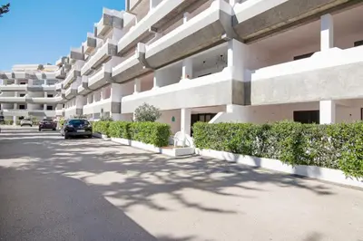 a building with a car parked in front of it at Apartamento Joyce by Sunnyway in Albufeira