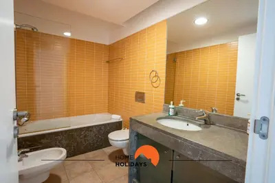 a bathroom with a sink and a toilet and a tub at #111 Ocean View by Home Holidays in Albufeira