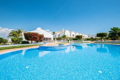 a large swimming pool with blue water at Beachsun Gale - beautiful villa close to beach in Galé