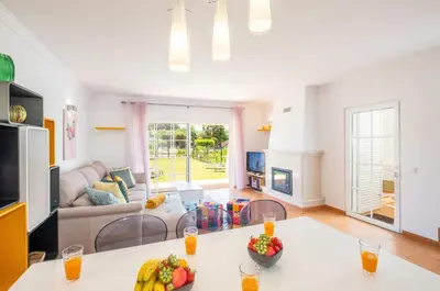 a living room with a table and a couch at Beachsun Gale - beautiful villa close to beach in Galé