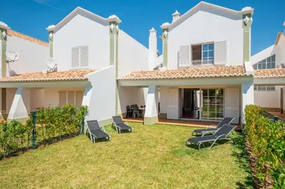 a backyard with chairs and a house at Beachsun Gale - beautiful villa close to beach in Galé