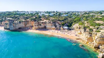 an aerial view of a beach with people on it at Villa Habitate - pool fence & heating beach bars in Albufeira
