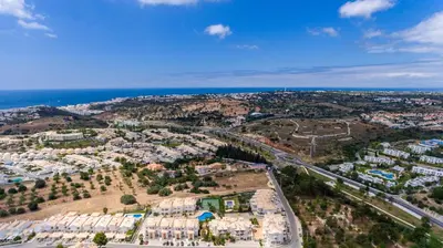 an aerial view of a city with the ocean at Apartment Hugo - Complex perfect for families in Albufeira