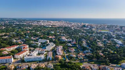 an aerial view of a city with the ocean at Terraços do Mar Apartment W/ Pool by LovelyStay in Vilamoura
