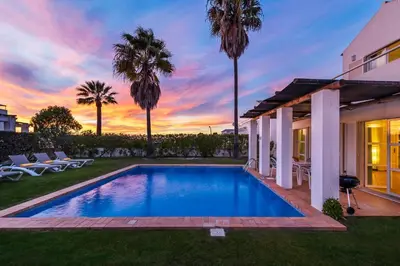 a swimming pool in the backyard of a house at Villa Luz do Atlantico by OCvillas in Galé