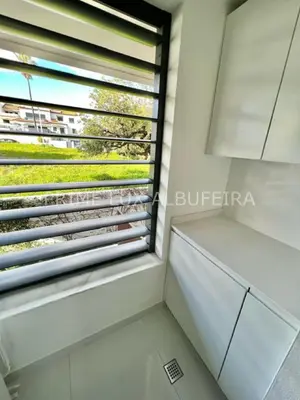 a room with a large window in a building at Prime Lux Albufeira in Albufeira
