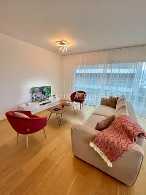 a living room with a couch and a table at Prime Lux Albufeira in Albufeira