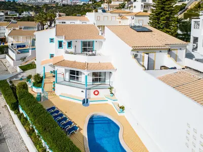 an aerial view of a house with a swimming pool at Villa Loria - beautiful panoramic views in Albufeira