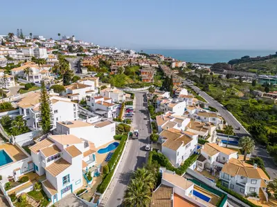 an aerial view of a city with houses and the ocean at Villa Loria - beautiful panoramic views in Albufeira