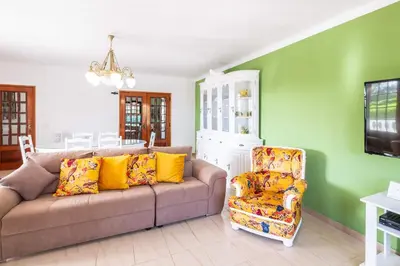 a living room with a couch and a chair at Patroves Ranch - private pool & sea views in Albufeira