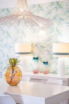 a white table with a vase on top of it at Apartment Esta - Tennis court and pool in Albufeira