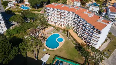 an overhead view of a large building with a swimming pool at Sweet As by LovelyStay in Quarteira
