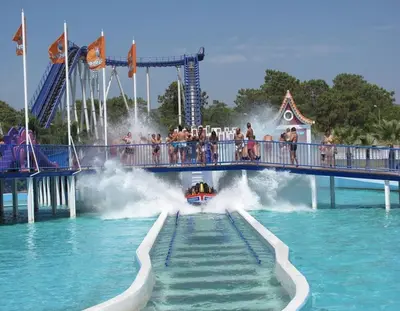 a water amusement park with a roller coaster at Quarteira Beach Vacation: 2BR steps to the sand in Quarteira